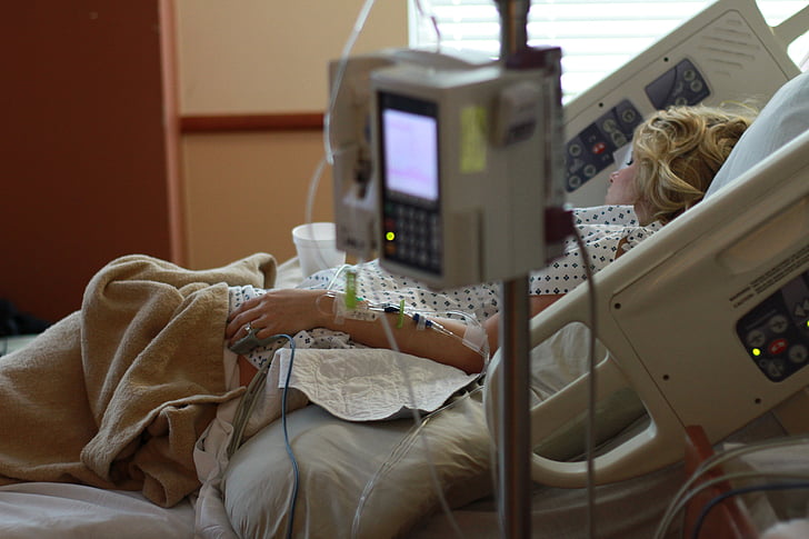A critically ill patient receiving continuous renal replacement therapy (CRRT) in an intensive care unit, representing kidney support treatment for unstable patients.