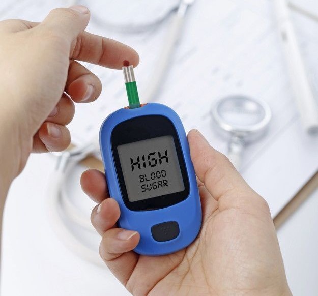 Critical care specialist monitoring diabetic emergency patient in ICU with medical equipment