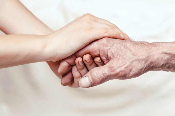 Critical care specialist providing compassionate palliative care to the ICU patient and family